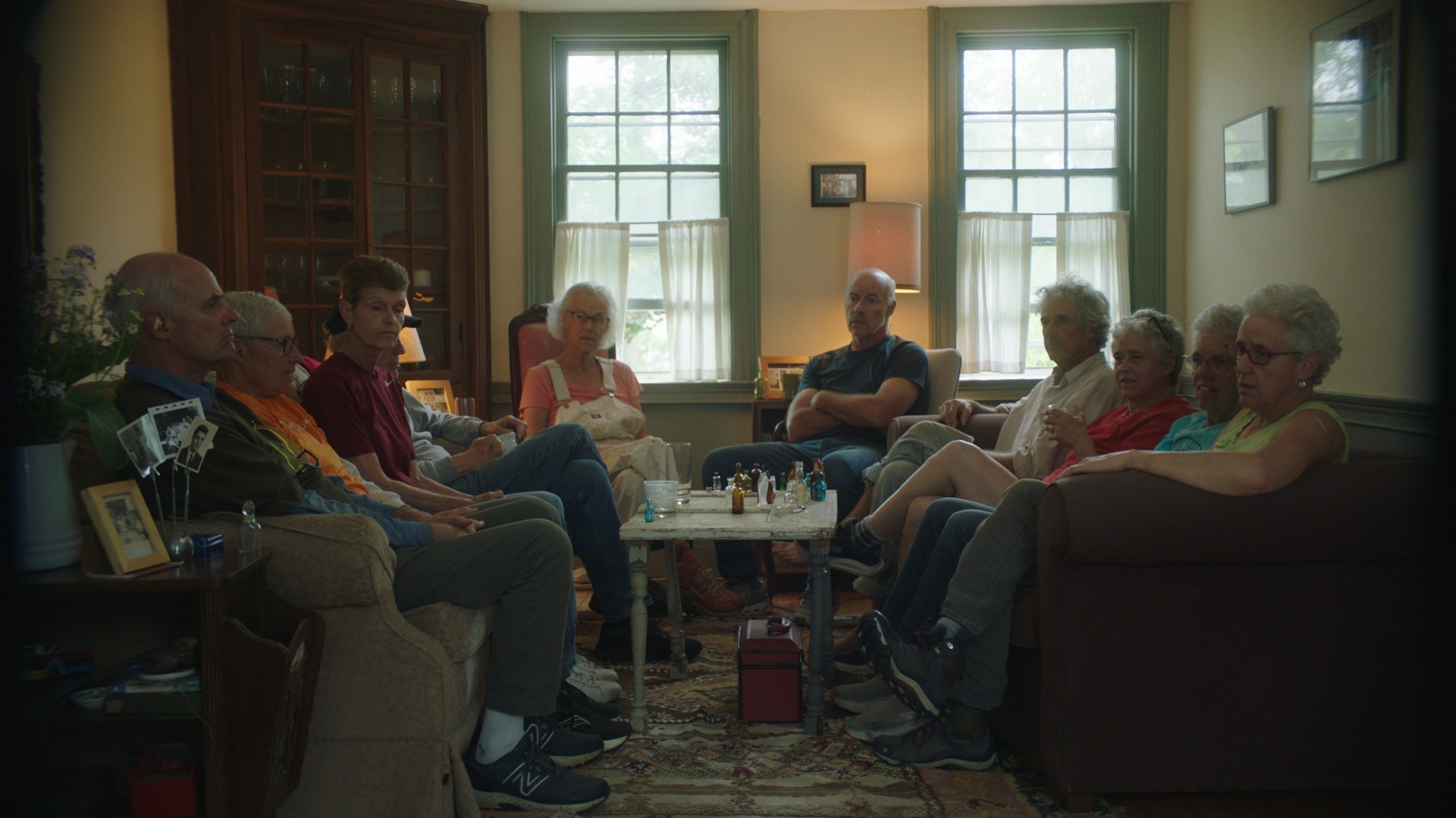 The ten siblings gathered together in the living room