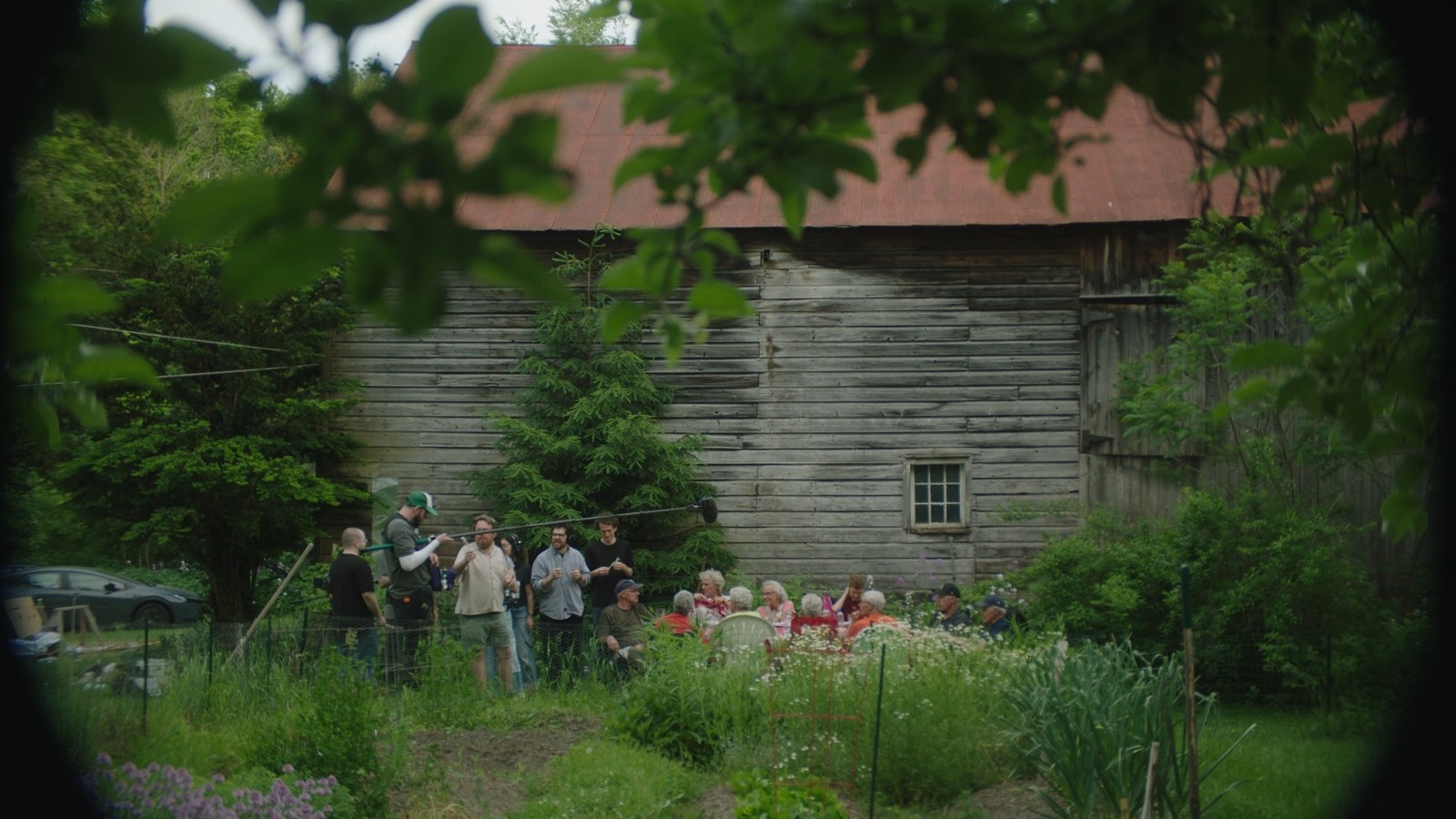 The Newville family gathers outside their childhood home with the film crew